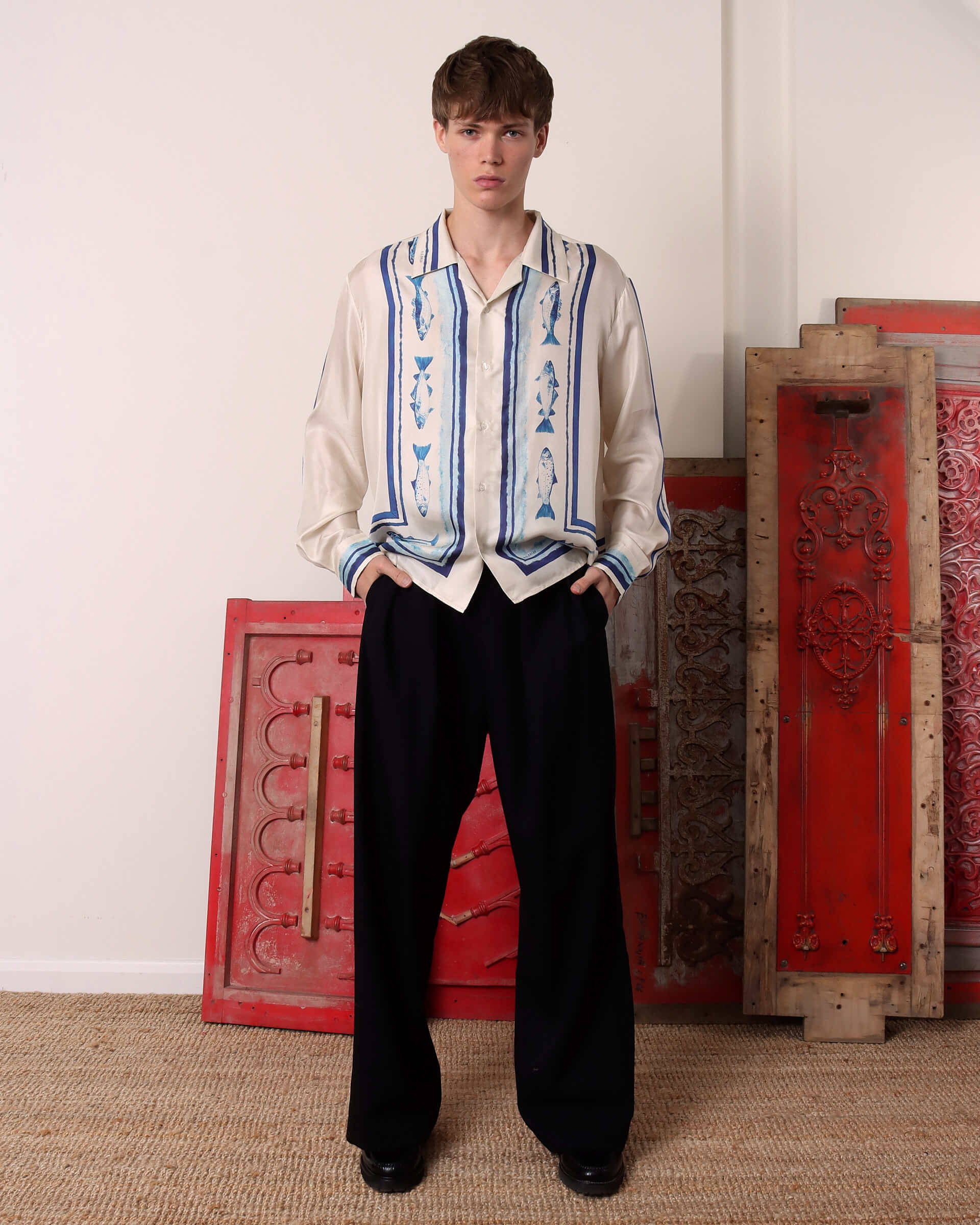 A model wears the 'Elliot' Silk Shirt with long sleeves in blue and ecru.
