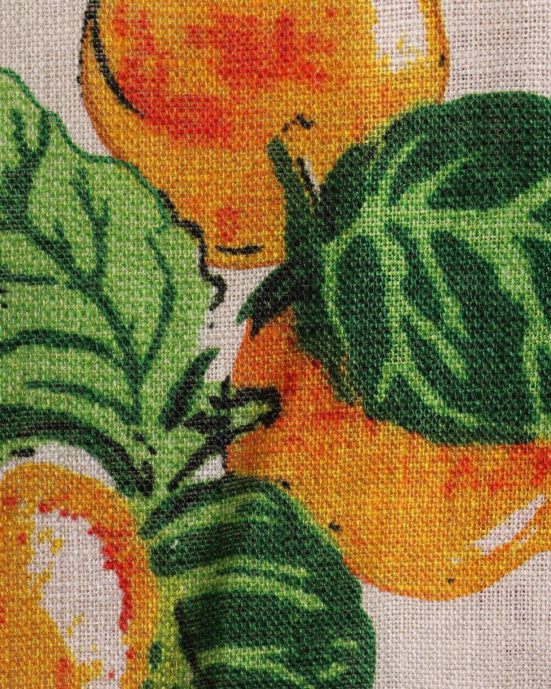 A close-up of the 'Picnic' Shirts Irish tea-towel inspired fruit print. This section includes vibrant oranges with detailed green leaves.