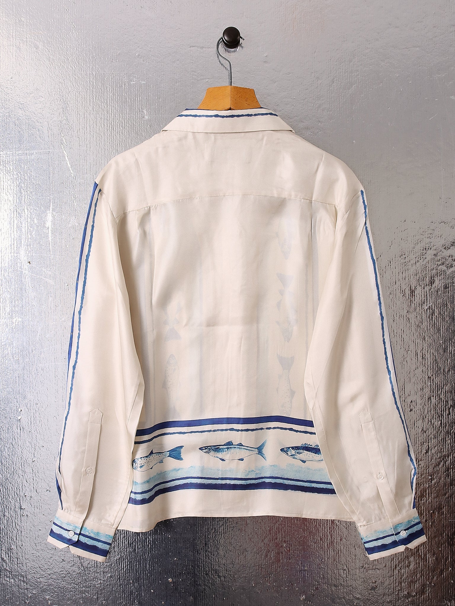 A flat shot shows the back of the 'Elliot' Silk Shirt.