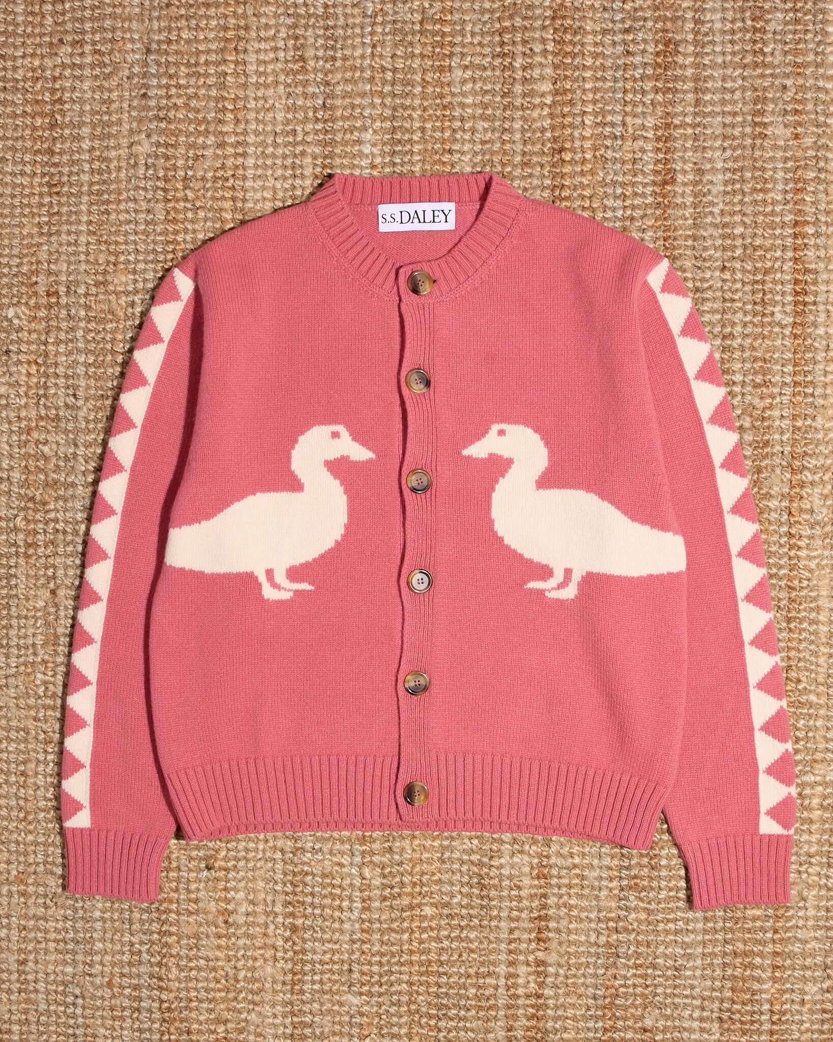 A flat shot of the 'Jasper' Cardigan in pink buttoned up.