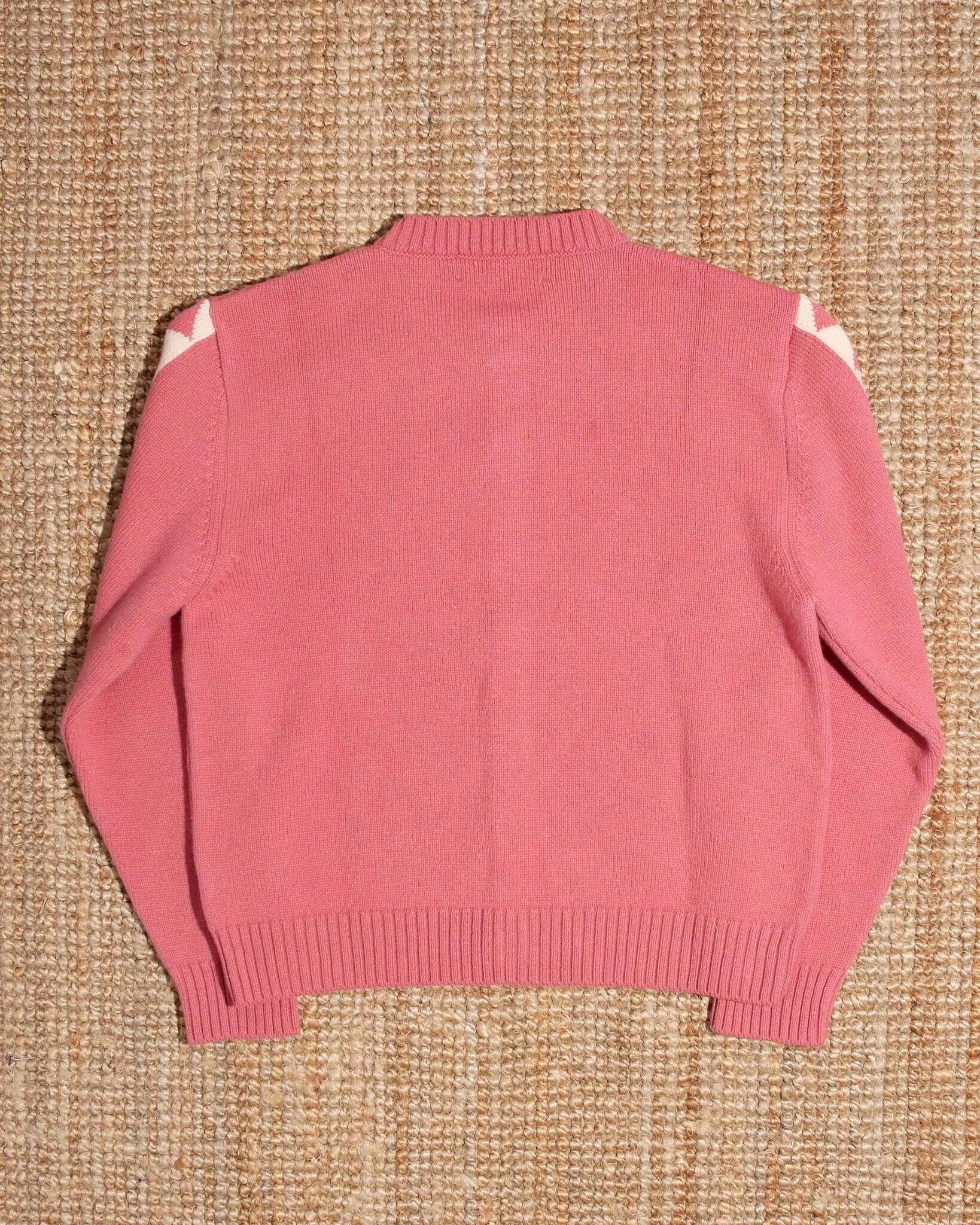 A flat shot of the back of the 'Jasper' Cardigan in pink.