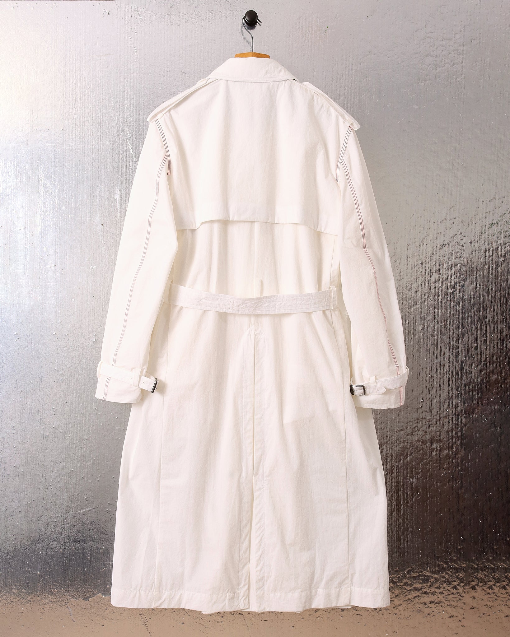 A flat shot of the white 'Sophia' Trench showing the back.