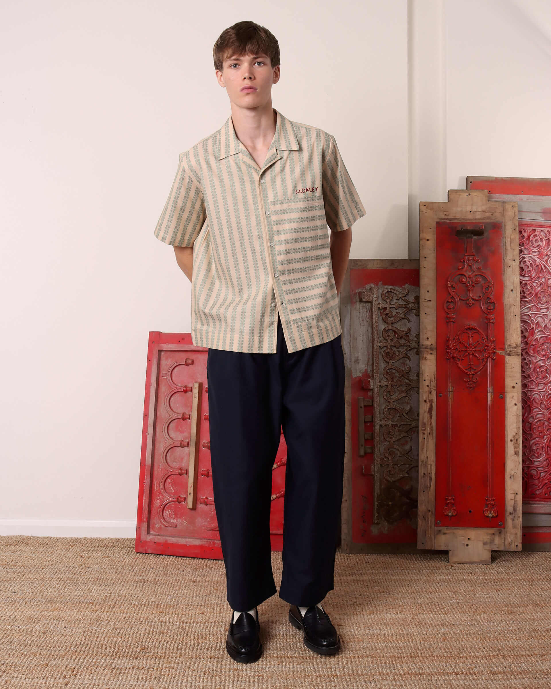 A model wears the 'Arte' Jacquard print shot sleeve shirt.