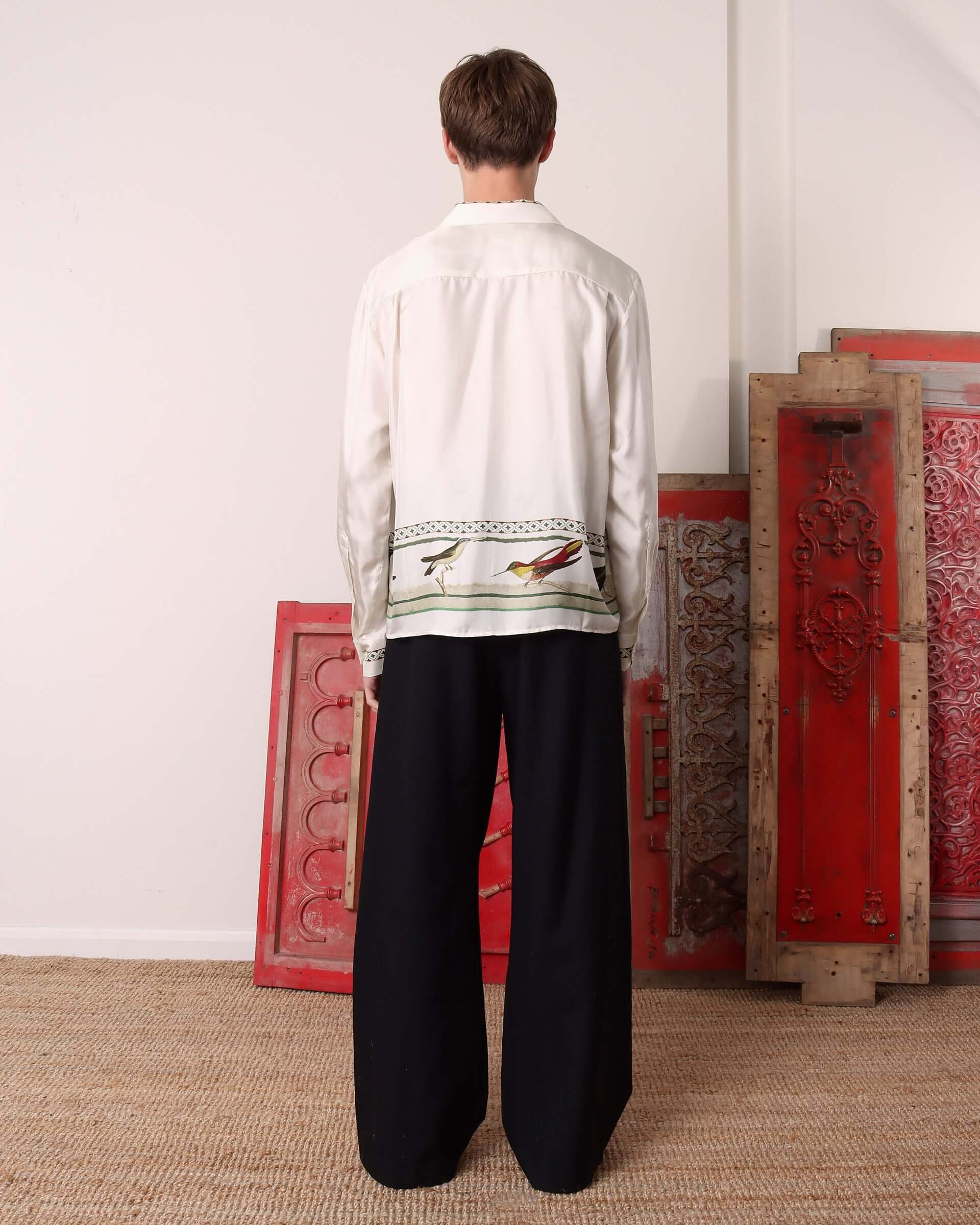 A model shows the back of the long sleeve 'Birdwatcher' Shirt.