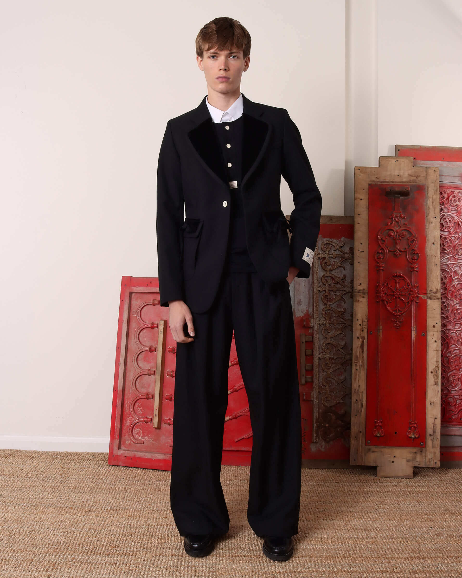 A model wears the 'George' Single Breasted Suit Jacket unbuttoned.