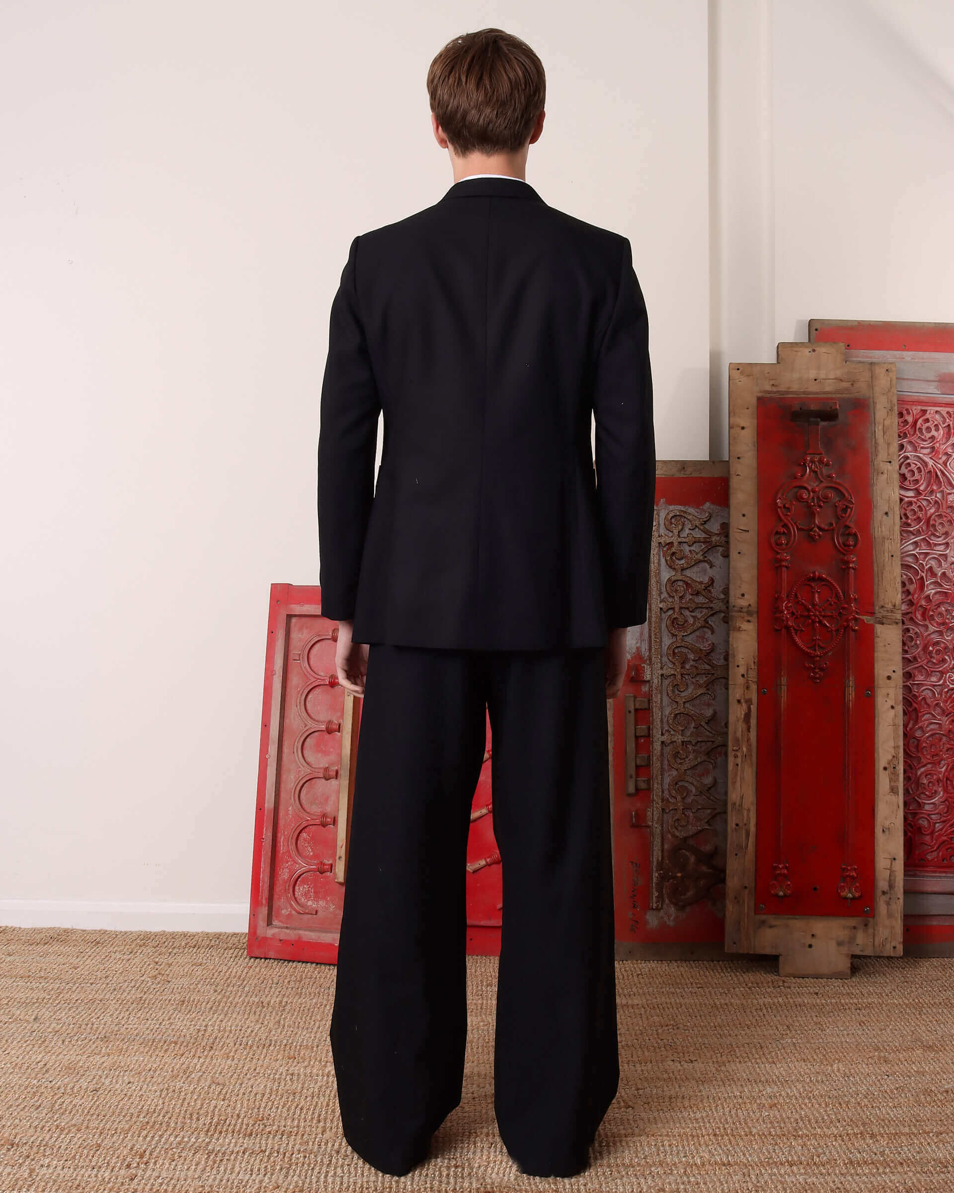 A model shows the back of the 'Albert' Single-Breasted Suit Jacket.