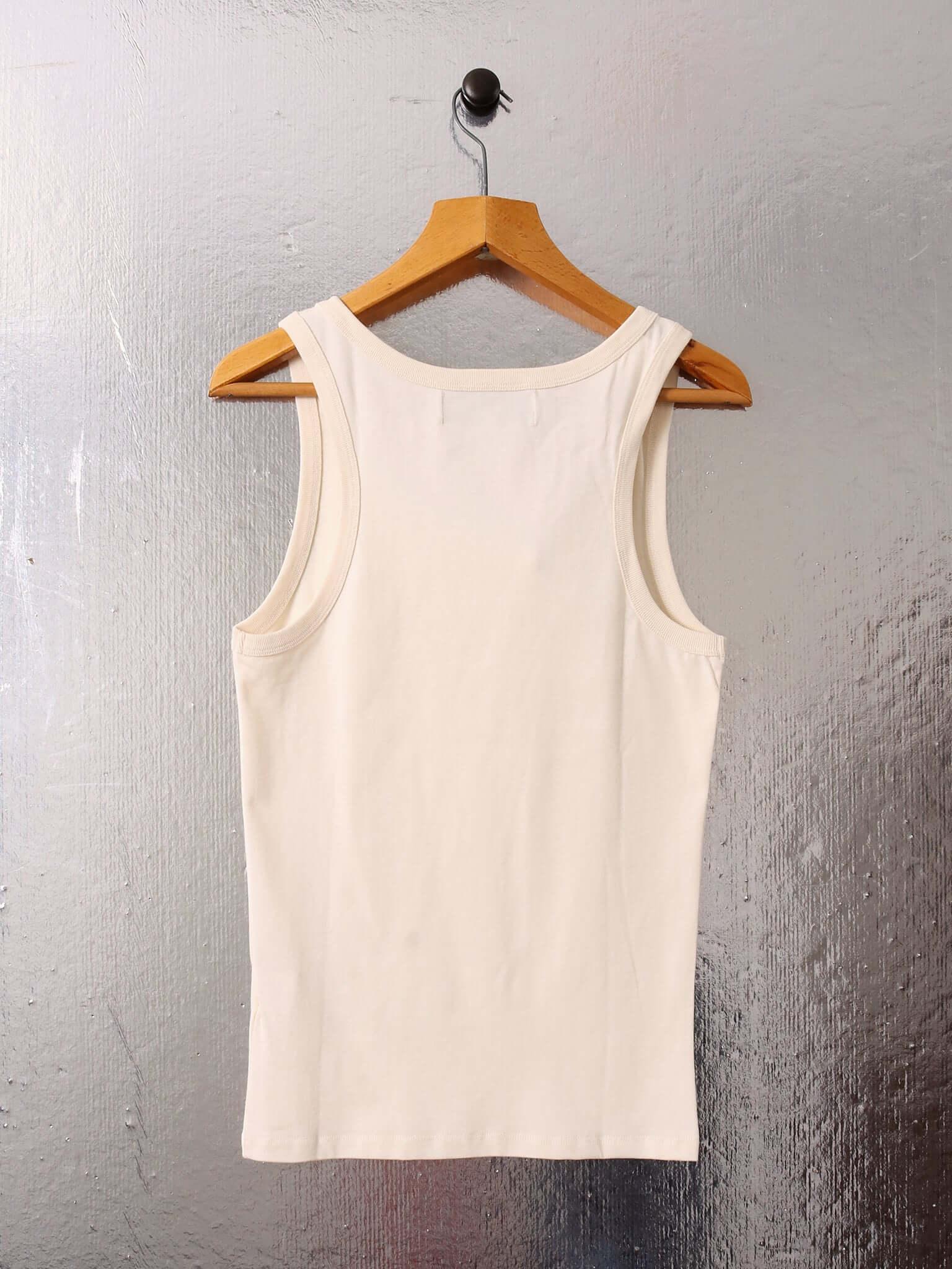 A flat image of the 'Cochrane' Vest in ecru, showing the back and the vest style of the garment.