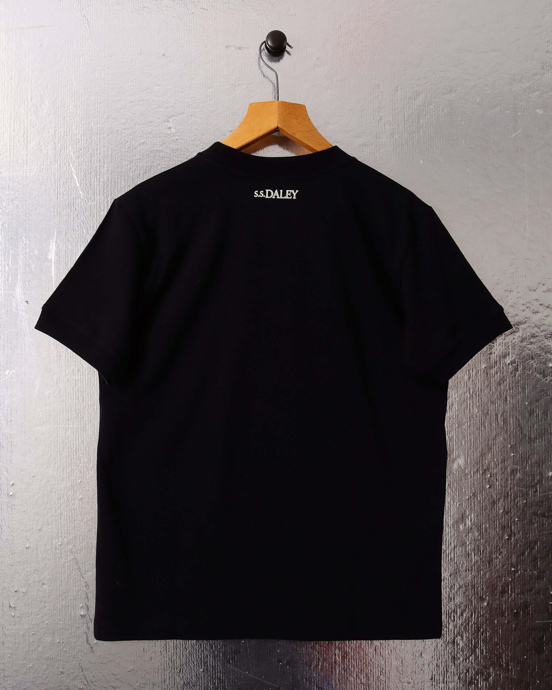 The back of the gender neutral tee shirt design featuring a delicate S.S.DALEY logo.