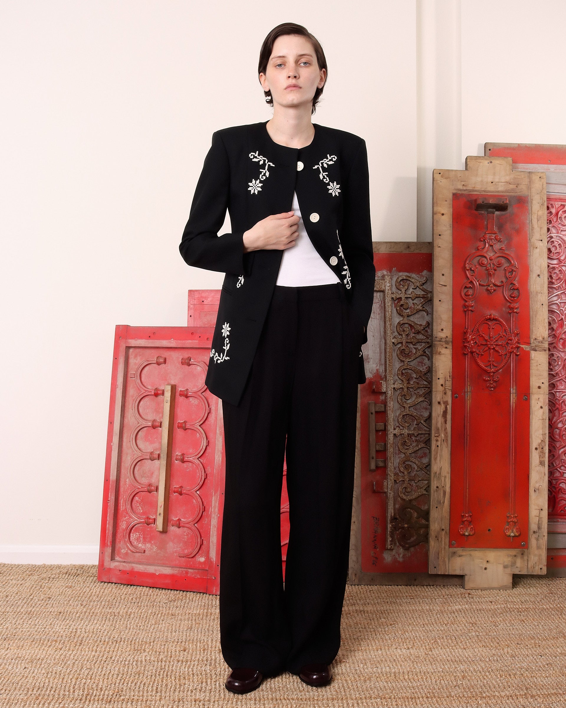 A model wears the black 'Ophelia' jacket unbuttoned except for the top button.