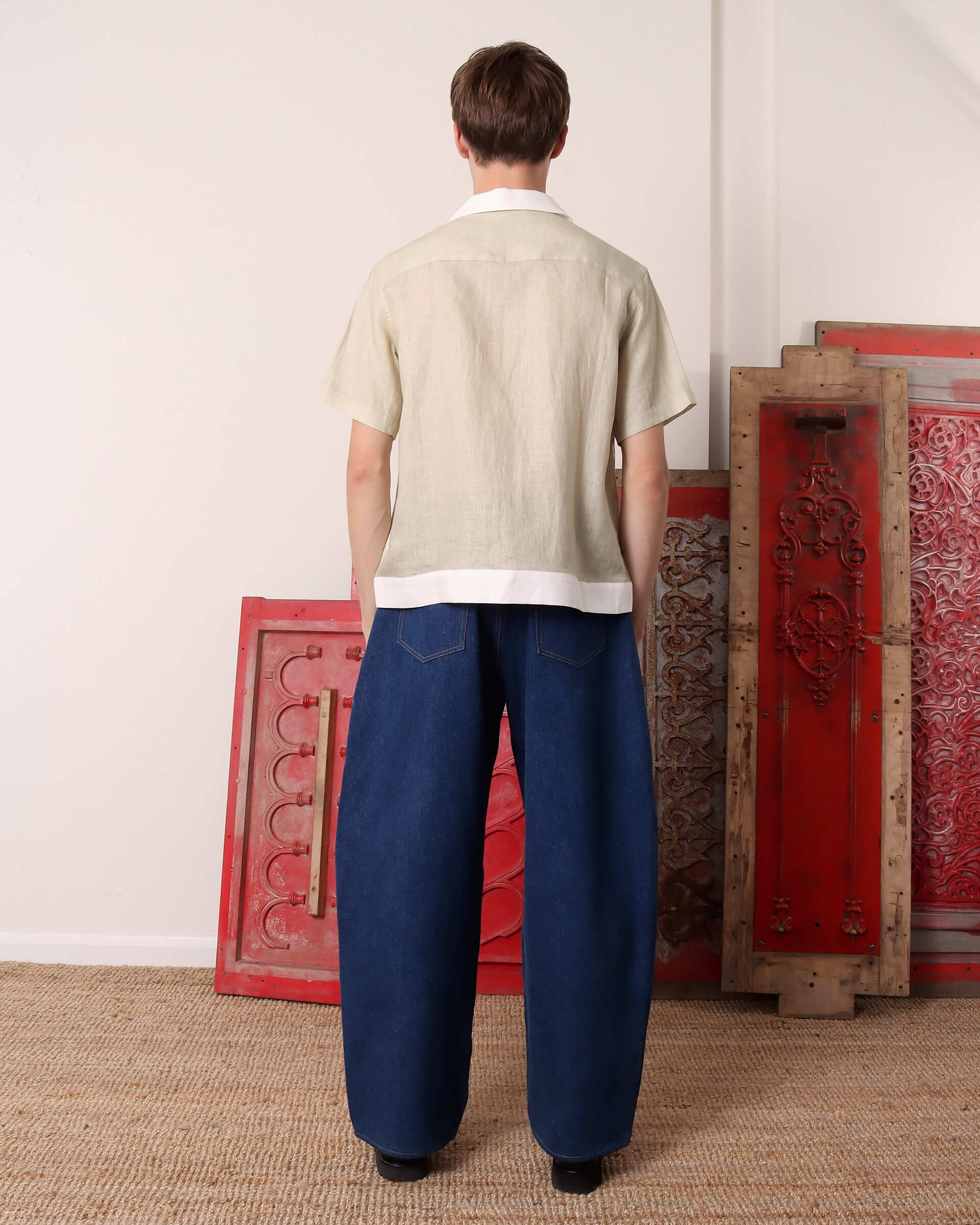 A model shows the back of the 'Lancashire' Sheep Shirt.