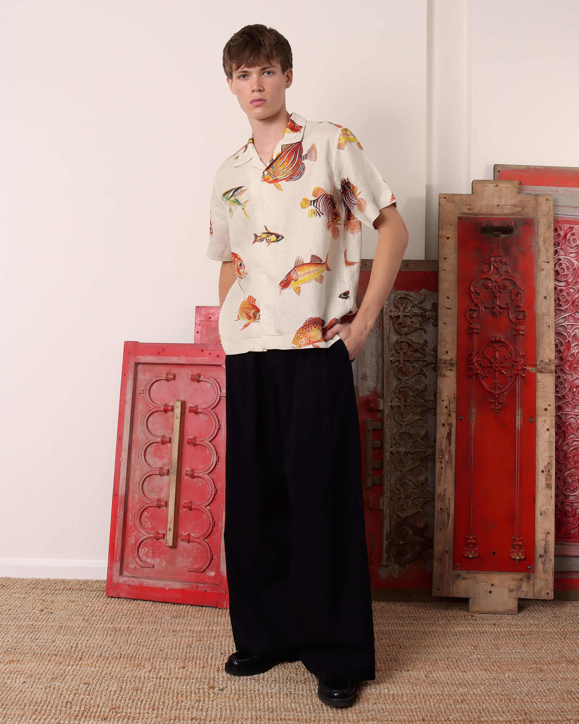 A model wears the 'Benjamin' Short Sleeve Shirt with a pair of black 'George' Trousers. 