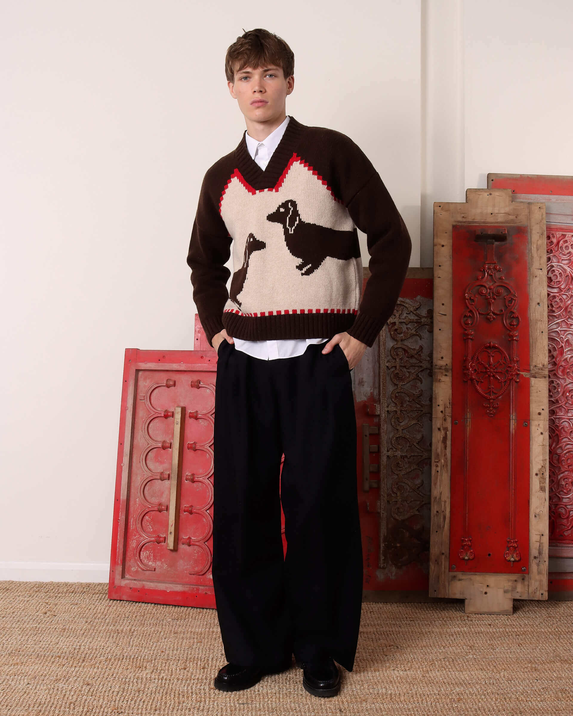 A model wears the 'Harold' V-Neck Sweater Vest in brown and ecru.