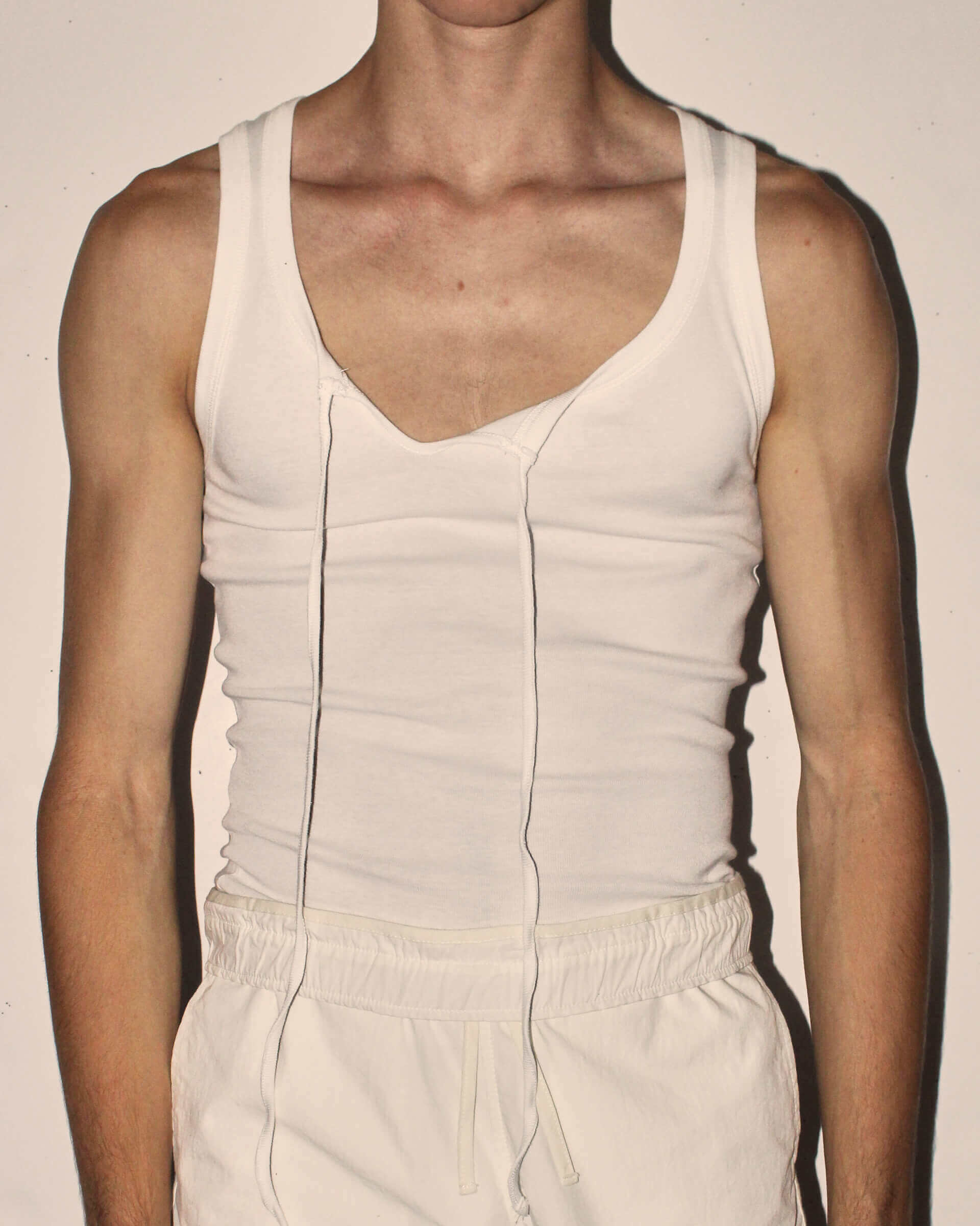 A detail shot of the untied 'Cochrane' Vest in white.