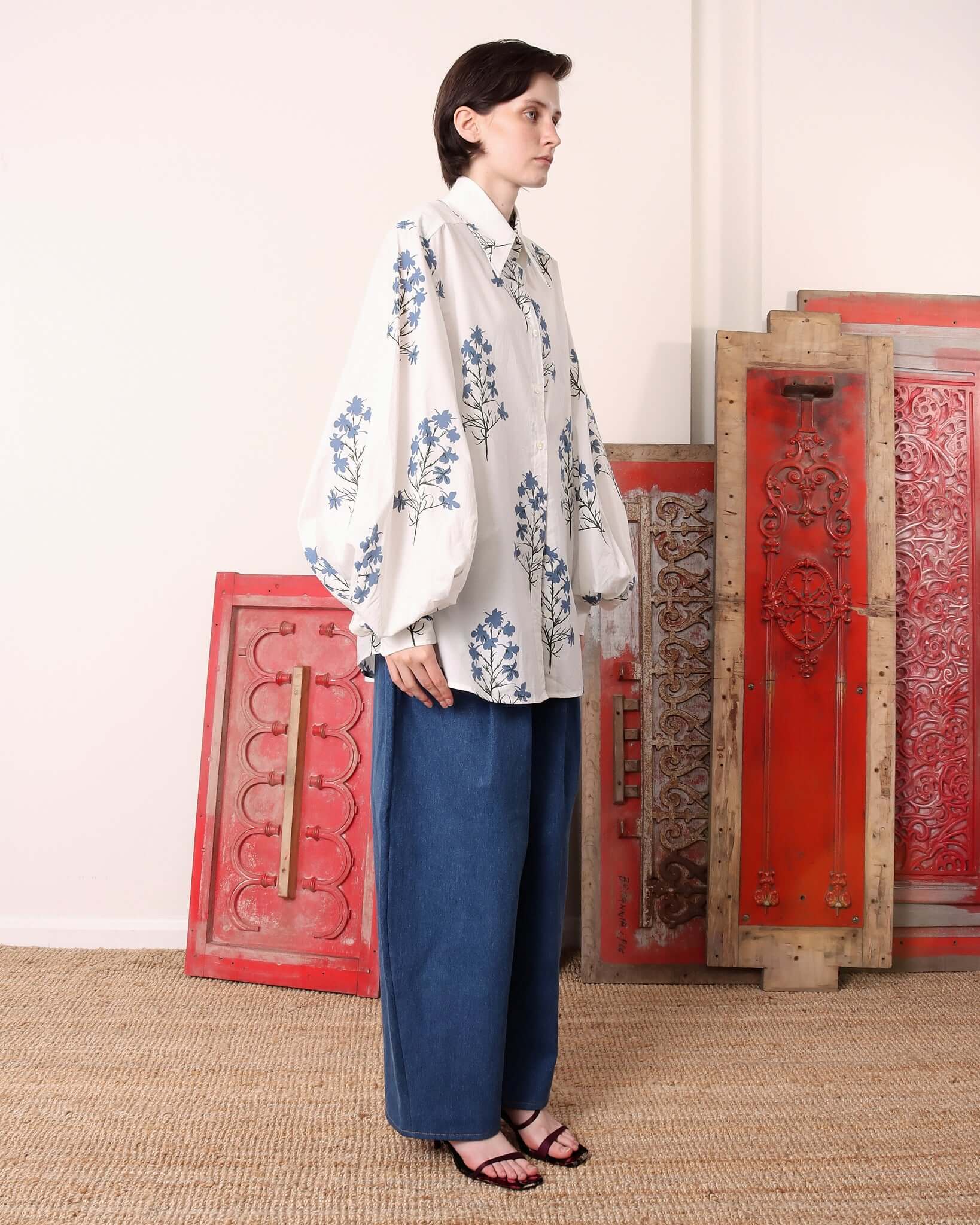 A model stands to the side, showing the 'Clem' Shirt's voluminous rounded sleeves and relaxed silhouette.