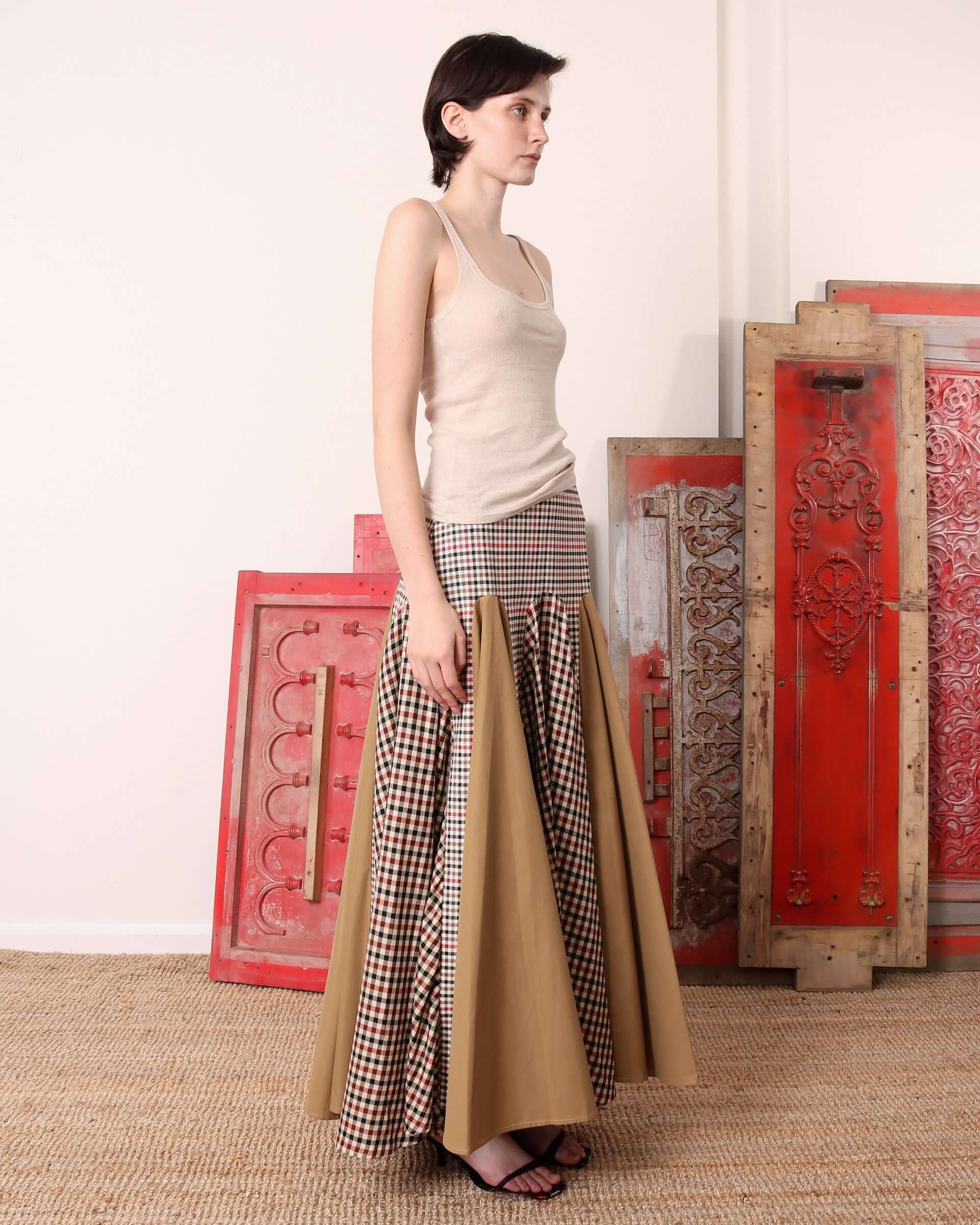 A model shows the side of the 'Taali Skirt in check.