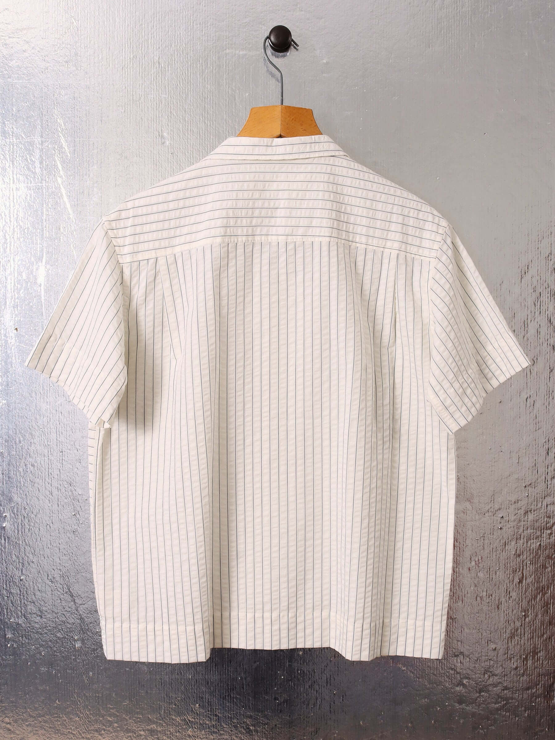 A flat shot of the seersucker 'Turing' Shirt, displaying it's boxy yet relaxed fit.