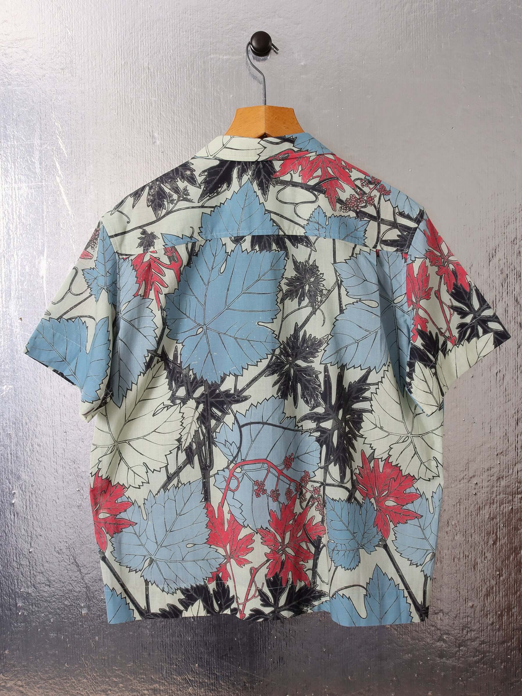 A flat shot of the back of the 'Otis' Shirt showing the short sleeves and boxy fit. 