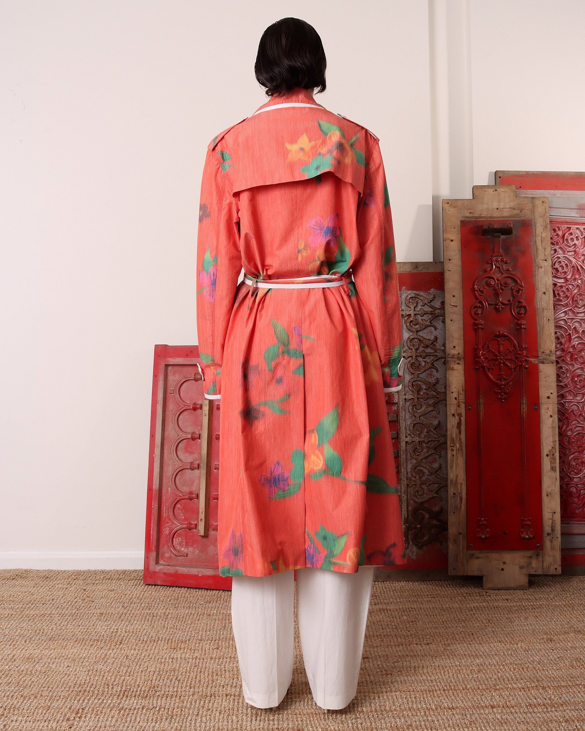 A model shows the back of the 'Sophia' Trench with the attached belt tied in the front.