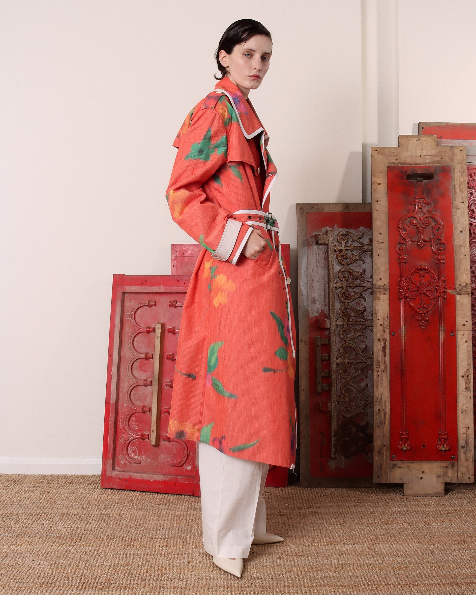 A model shows the side of the 'Sophia' Trench in floral with a light red base.