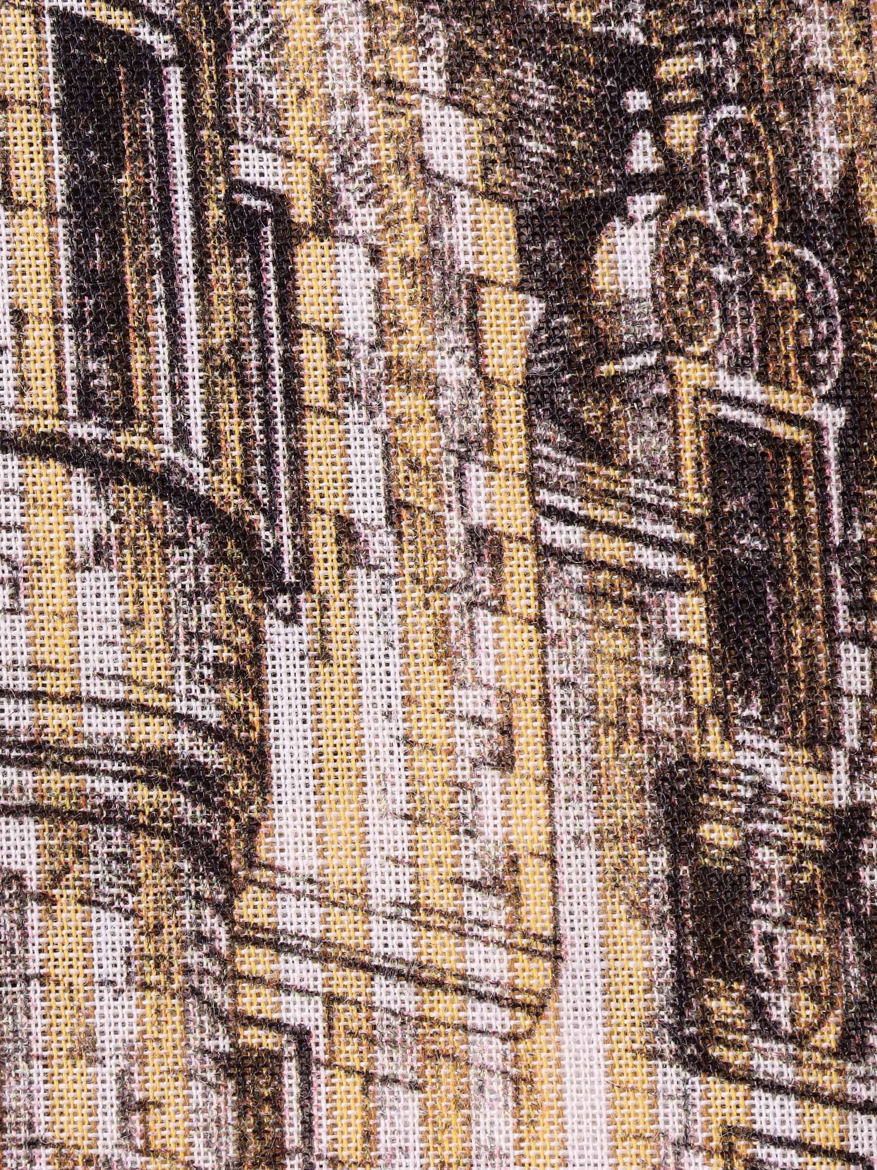 A close-up of a part of the 'Estate Sale' print featuring historical black lithograph printed motif details on a yellow and ecru base.