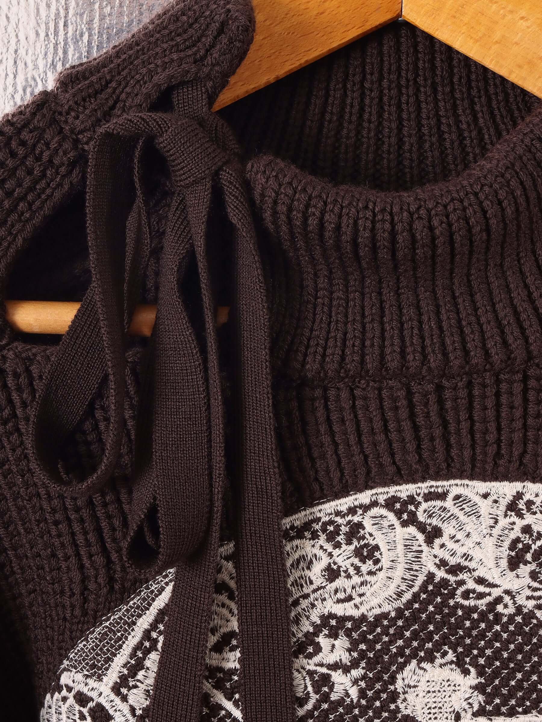 A close up showing the asymmetric tie neckline inspired by vintage British 1920s rowing jerseys. 